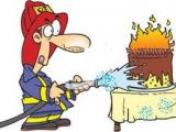 A_fireman_putting_out_candles_on_a_birthday_cake.jpg